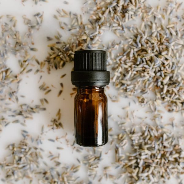 a small bottle over white surface